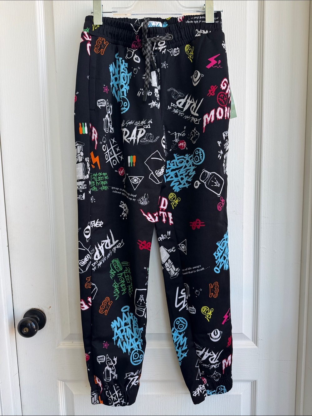 Fresh Prints of Bel-Air Black Graffiti Print Joggers manufactured by Drill Clot